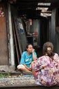 Women living in a slum doing laundry